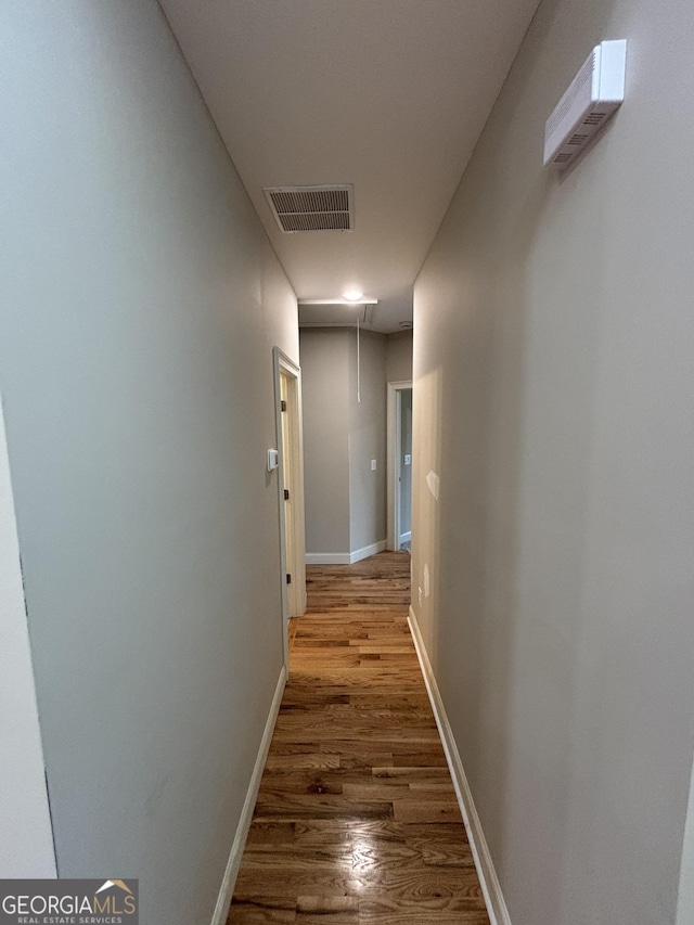5544 Whispering Swan Ct, Douglasville, GA 30135 - hall with attic access, wood finished floors, and baseboards
