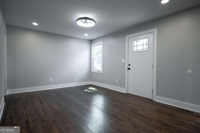 entrance foyer featuring dark hardwood / wood-style floors