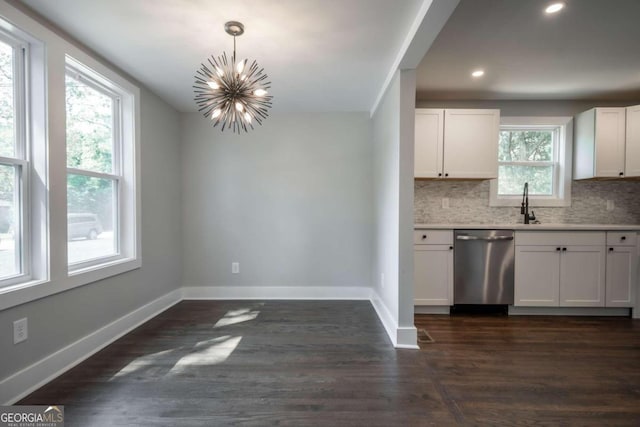 kitchen with white cabinets, a healthy amount of sunlight, decorative light fixtures, and dishwasher