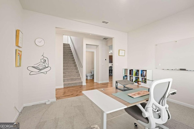 home office featuring hardwood / wood-style flooring