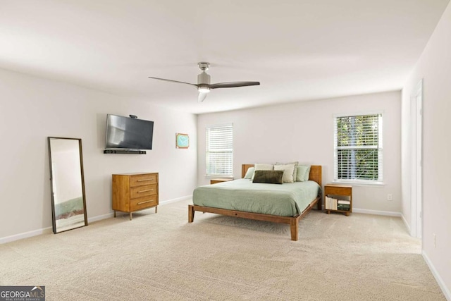 bedroom featuring light carpet and ceiling fan