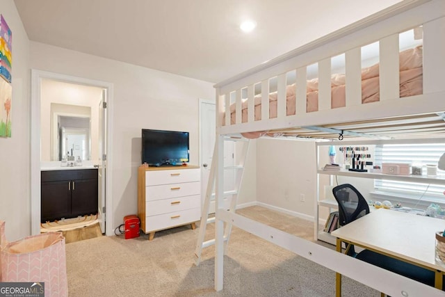 interior space with connected bathroom and sink