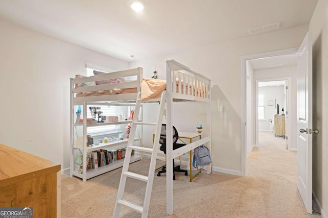 carpeted bedroom featuring multiple windows