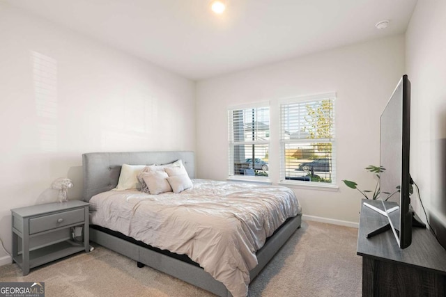 bedroom featuring light carpet