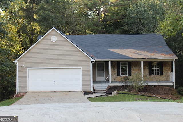 ranch-style house featuring a garage and a porch