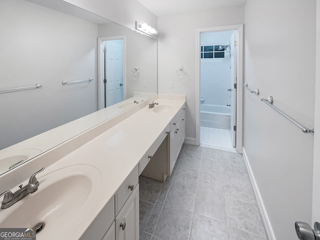 bathroom featuring vanity, a bathtub, and tile patterned floors