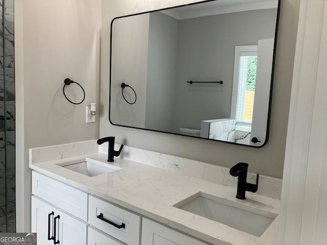 bathroom featuring vanity and toilet