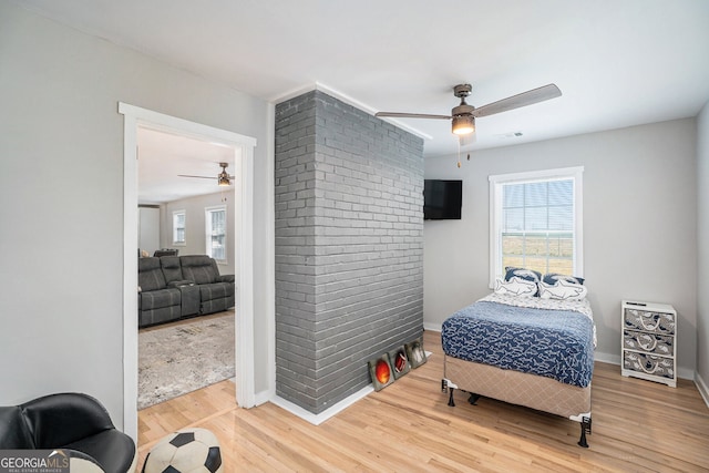 bedroom featuring ceiling fan and wood-type flooring