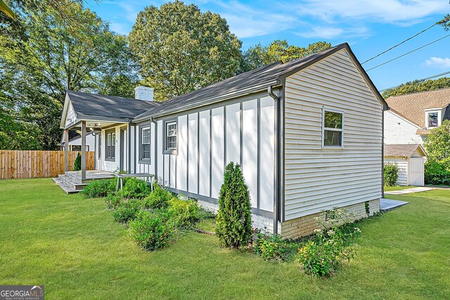 exterior space with a lawn and an outdoor structure