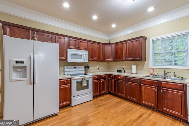 kitchen with crown molding, sink, white appliances, and light hardwood / wood-style flooring