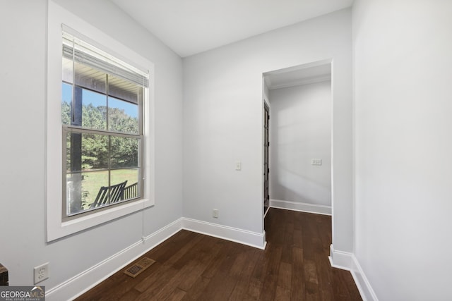 unfurnished room with dark hardwood / wood-style floors