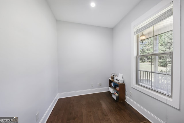 unfurnished room featuring dark hardwood / wood-style flooring