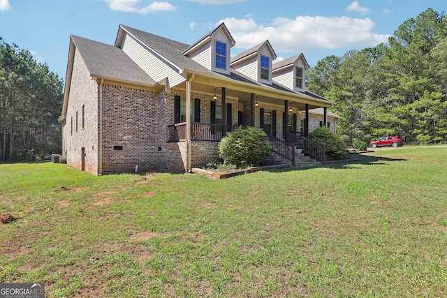 view of home's exterior with a yard and covered porch