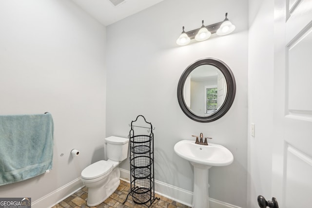 bathroom with toilet and sink