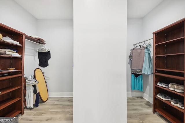 spacious closet featuring light wood-type flooring