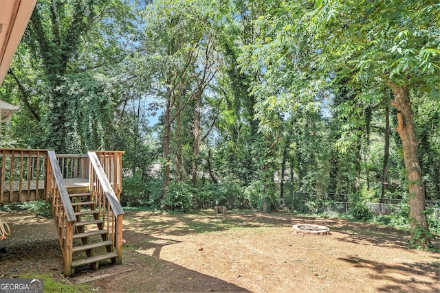 view of yard with an outdoor fire pit