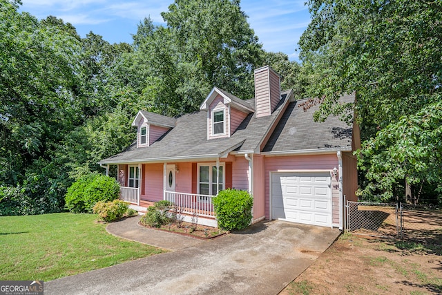 cape cod-style house with covered porch, a front yard, and a garage