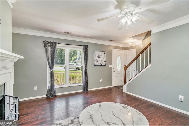 foyer featuring ceiling fan, crown molding, and dark hardwood / wood-style flooring