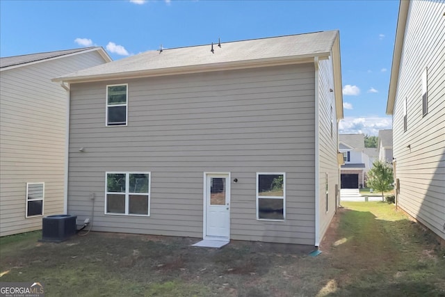 rear view of house with central AC