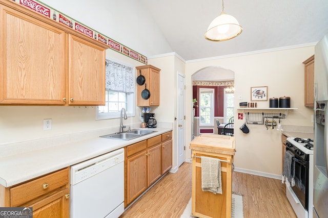 kitchen featuring a healthy amount of sunlight, hanging light fixtures, white appliances, and sink