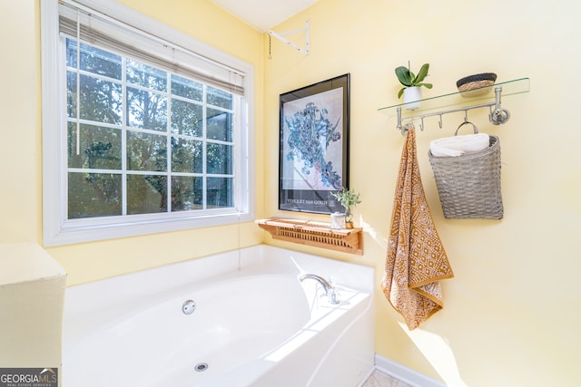 bathroom featuring a tub to relax in