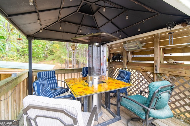 wooden deck featuring a gazebo