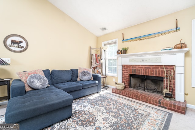 living room with carpet, a fireplace, and vaulted ceiling