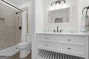 bathroom with wood-type flooring and tiled shower / bath combo