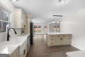 bathroom featuring a tub, hardwood / wood-style flooring, vanity, and toilet