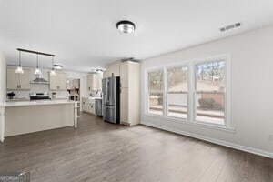 unfurnished bedroom with light carpet, a closet, and ceiling fan