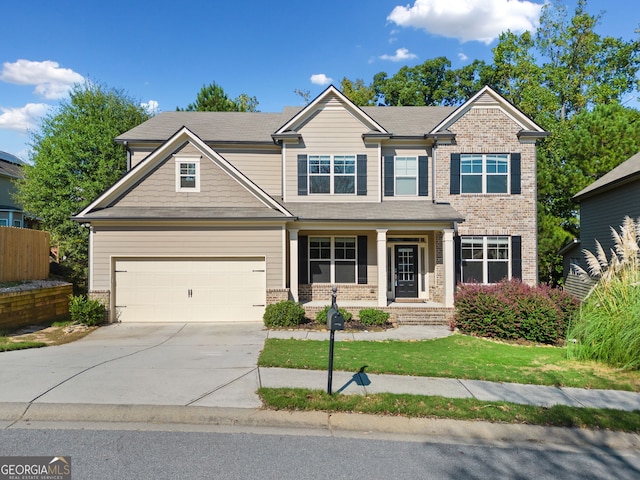 craftsman-style home featuring brick siding, an attached garage, and driveway