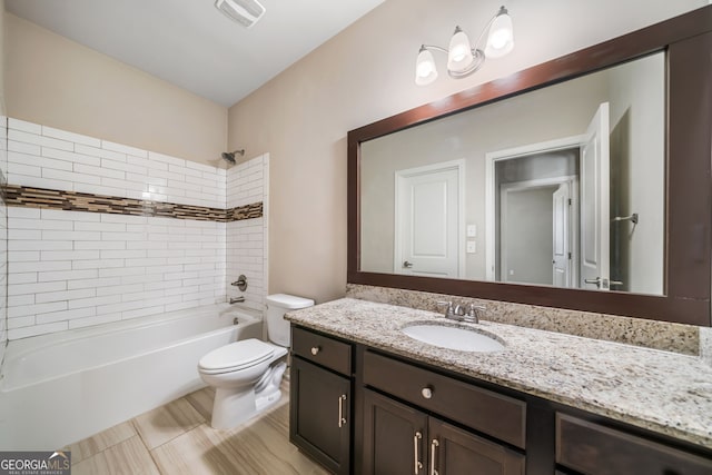 bathroom featuring visible vents, shower / washtub combination, toilet, and vanity