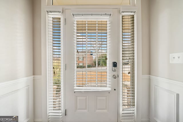 entryway featuring wainscoting