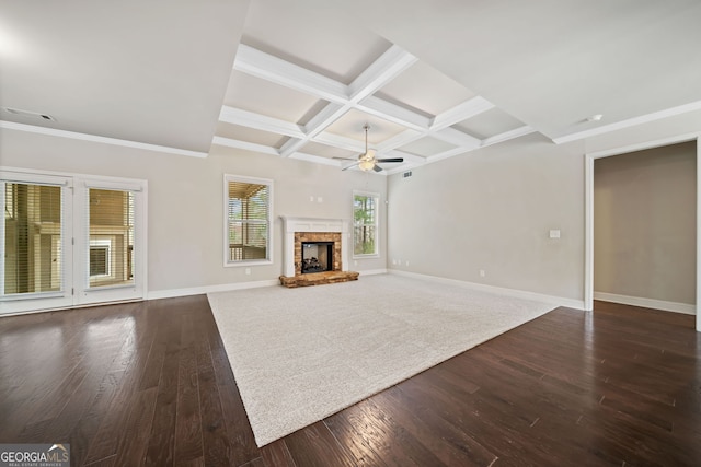 unfurnished living room with dark wood-type flooring, baseboards, coffered ceiling, and ceiling fan