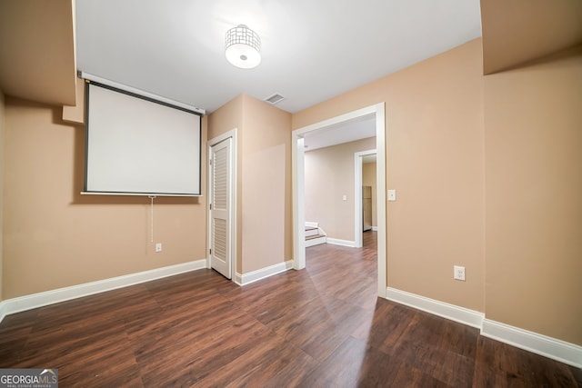 interior space with visible vents, wood finished floors, baseboards, and a closet