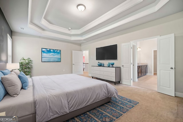 bedroom with visible vents, baseboards, light colored carpet, a tray ceiling, and ornamental molding