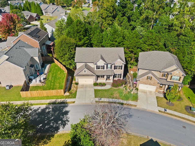 birds eye view of property with a residential view