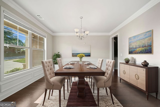 dining room featuring visible vents, a chandelier, dark wood finished floors, ornamental molding, and wainscoting