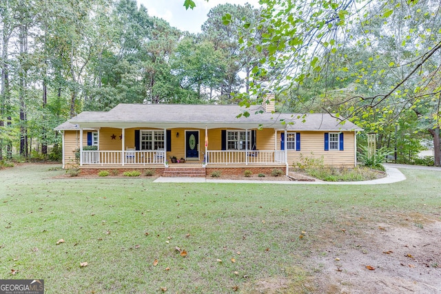 ranch-style home featuring a front yard and a porch