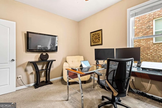 office space with carpet and ceiling fan