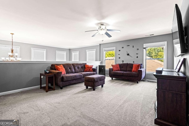 carpeted living room with ceiling fan and a wealth of natural light