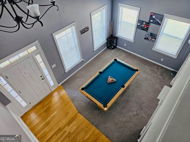 game room with an inviting chandelier, pool table, carpet flooring, and ornate columns