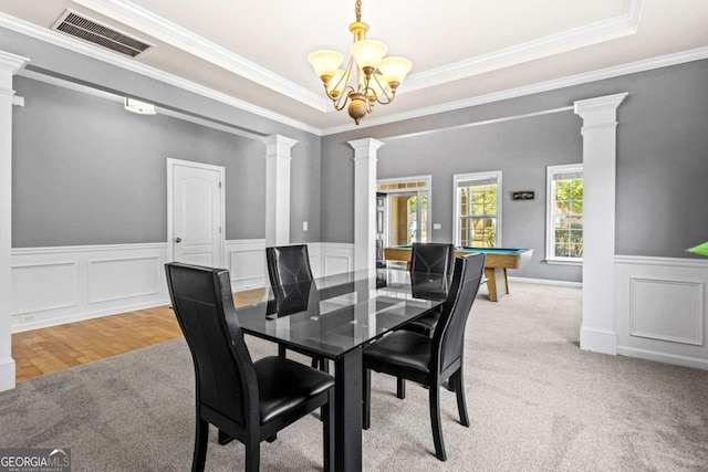 kitchen with backsplash, ceiling fan with notable chandelier, a kitchen island, pendant lighting, and stainless steel dishwasher