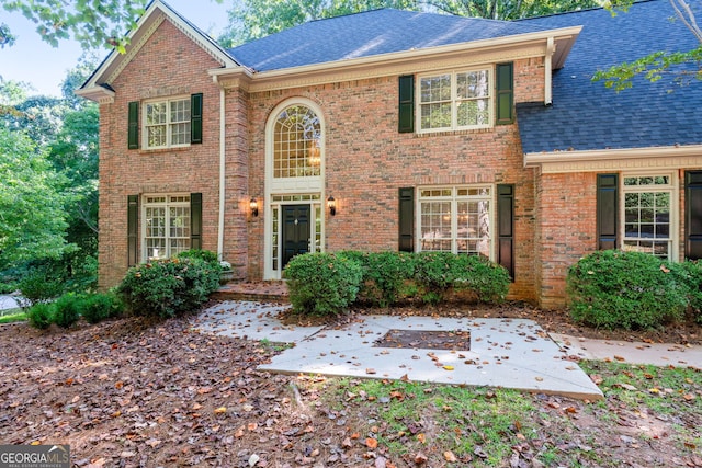 front facade with a patio area