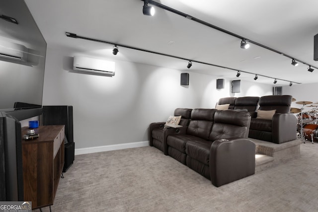 cinema featuring a wall mounted air conditioner, light colored carpet, and track lighting