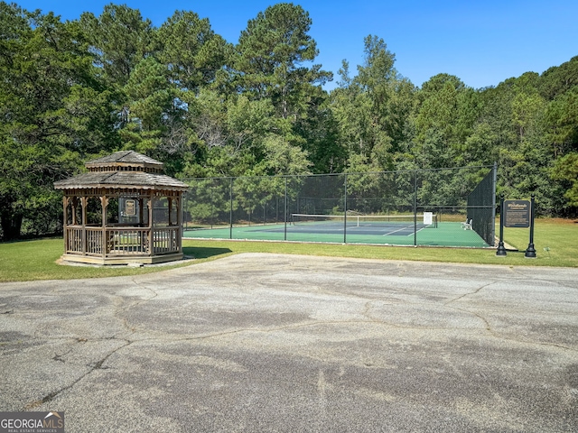 view of tennis court with a gazebo