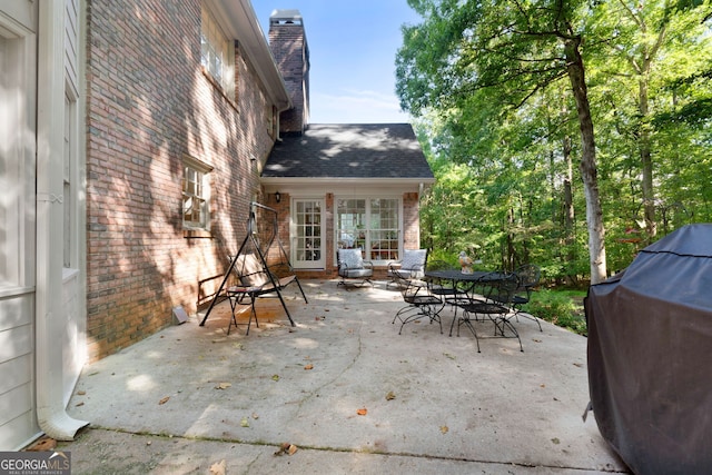 view of patio featuring a grill