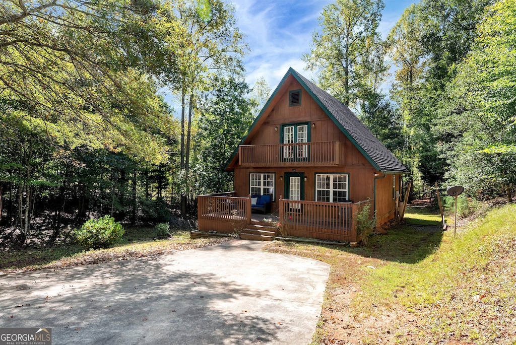 view of front of house featuring a wooden deck