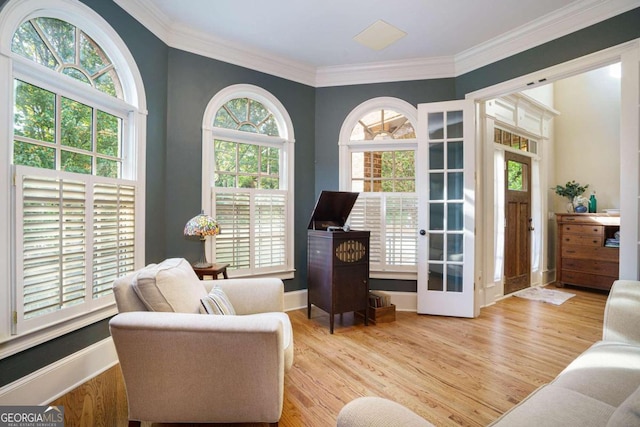 living room with a fireplace, high vaulted ceiling, and light hardwood / wood-style floors