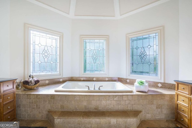 carpeted bedroom with crown molding, a tray ceiling, and ceiling fan